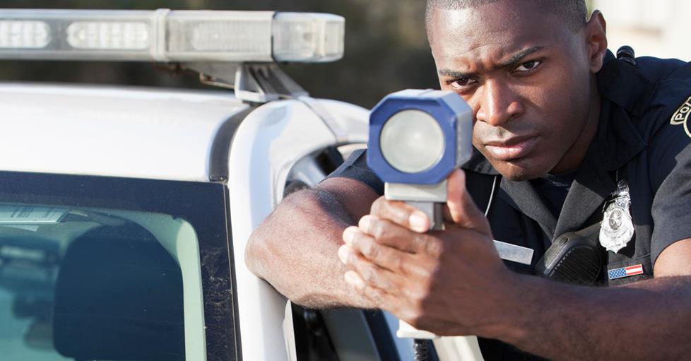 police officer with radar gun