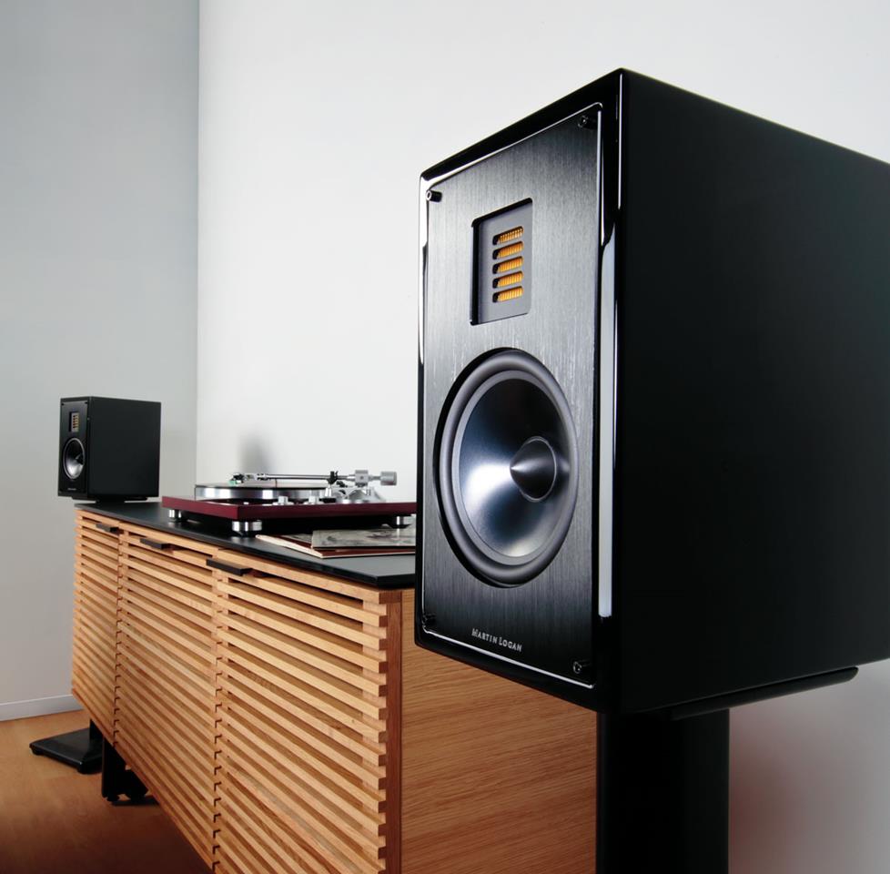 Martin Logan speakers on stands with a turntable