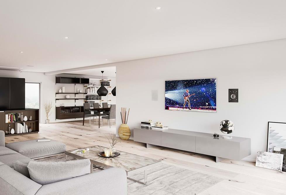A home fitted with in-wall and in-ceiling speakers.