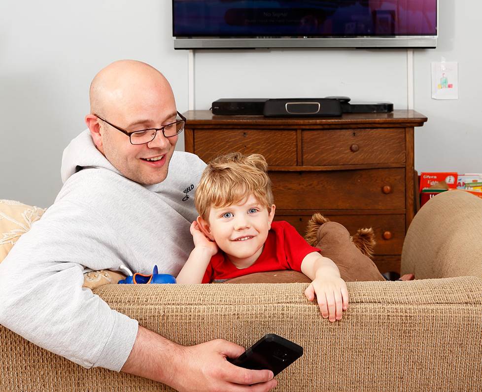 The author at home his his son
