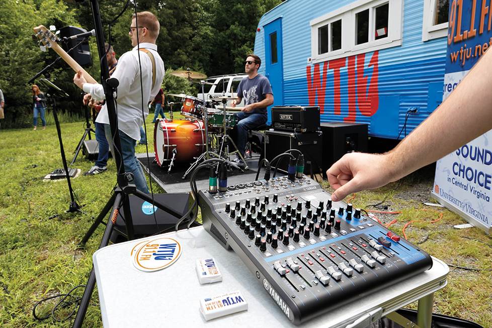 Adjusting mixer at outdoor concert