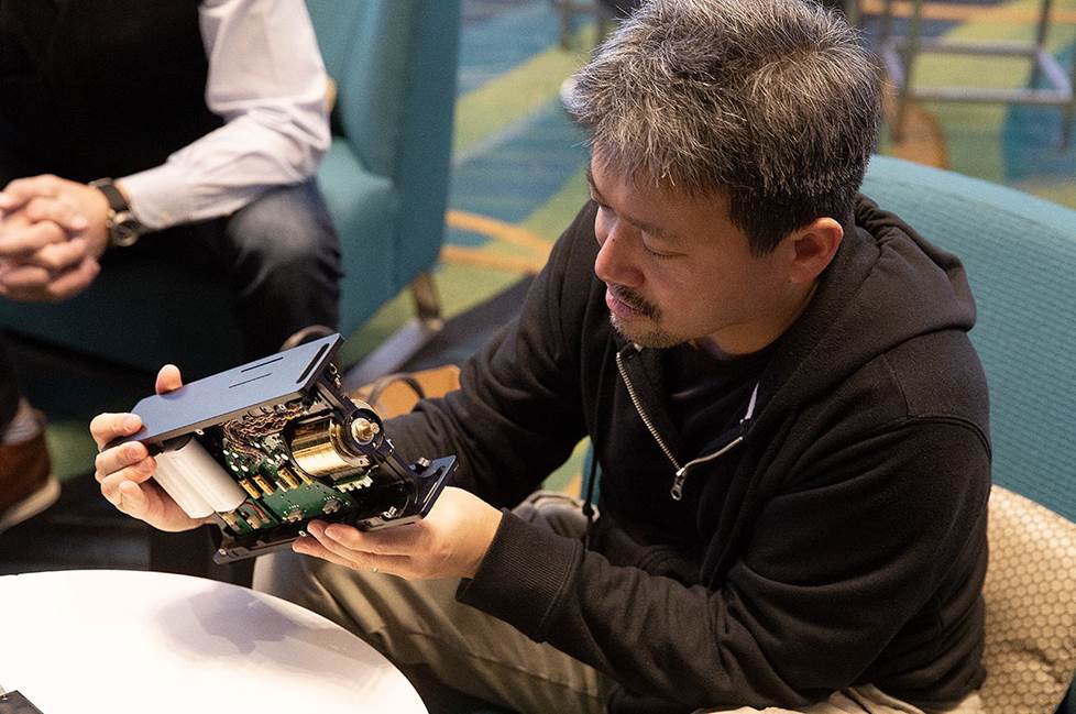 Man showing interior components of amp