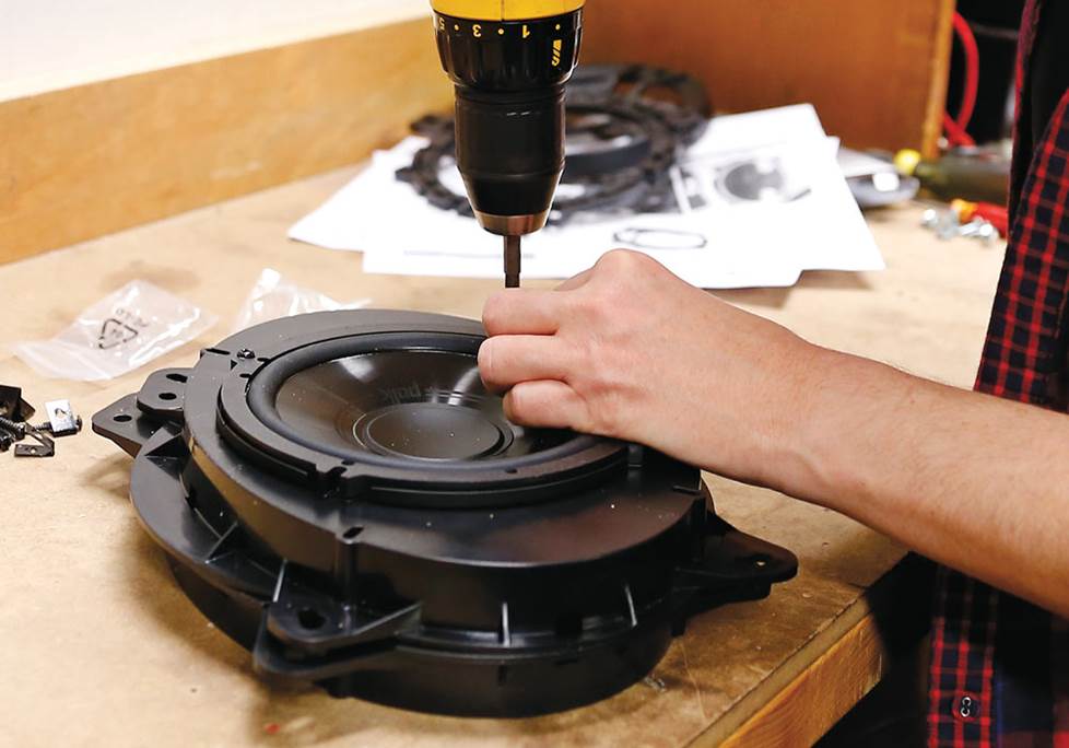 Rachel installing speakers in bracket