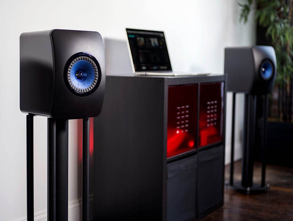 KEF LS50 speakers on stands in a room