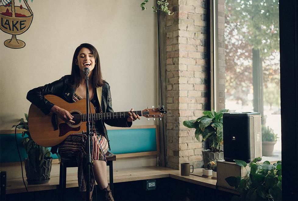 Musician playing acoustic guitar