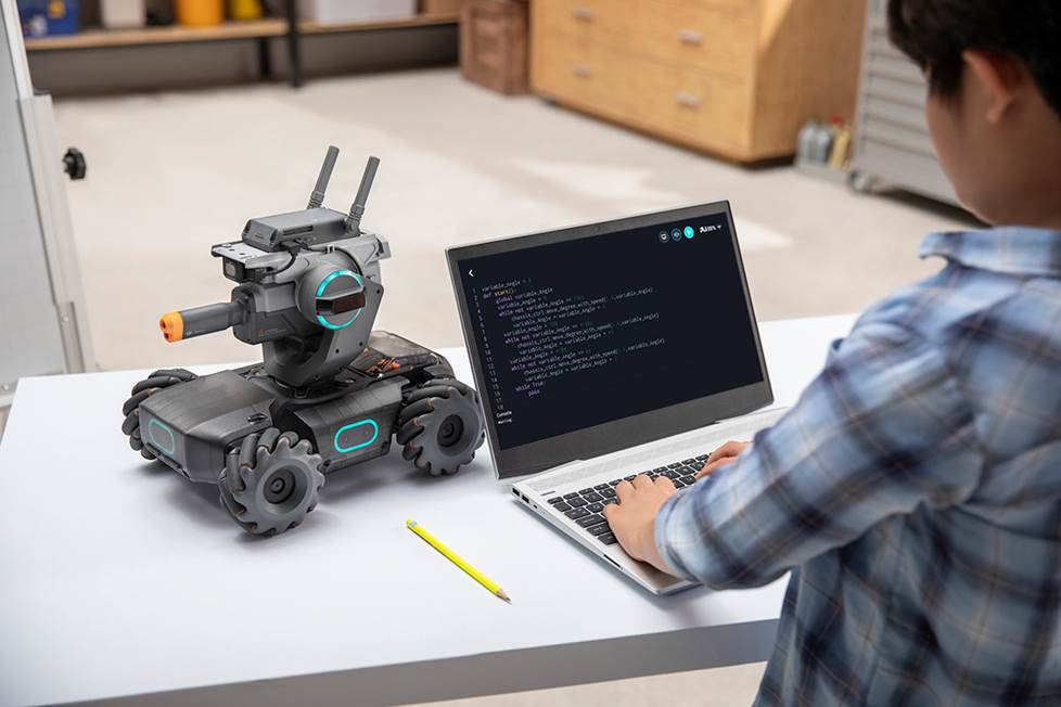 Child programming an educational drone
