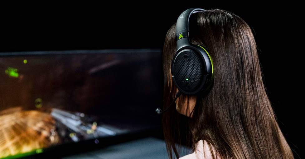Woman wearing the Penrose X playing a video game