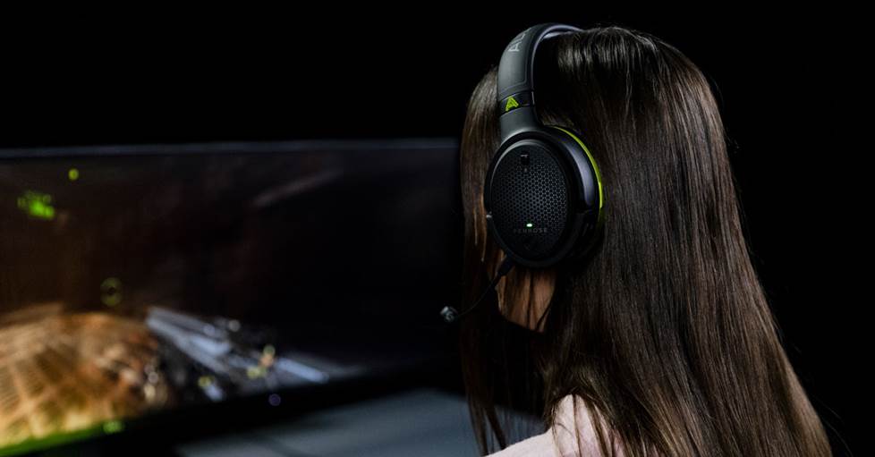 Gamer wearing the Audeze Pemrose headphones