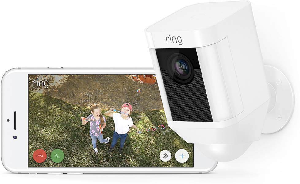 Ring Spotlight Cam and phone with app footage displayed