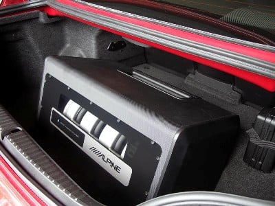 The trunk of the RX-8 has a depression and the ALPINE PLV-7 fit perfectly into it.