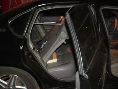 Mounted amp can be seen on backside of rear seat