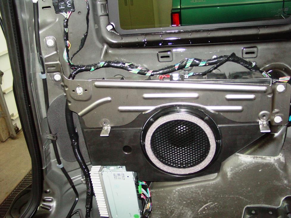 The factory subwoofer and amp (Crutchfield Research Photo)