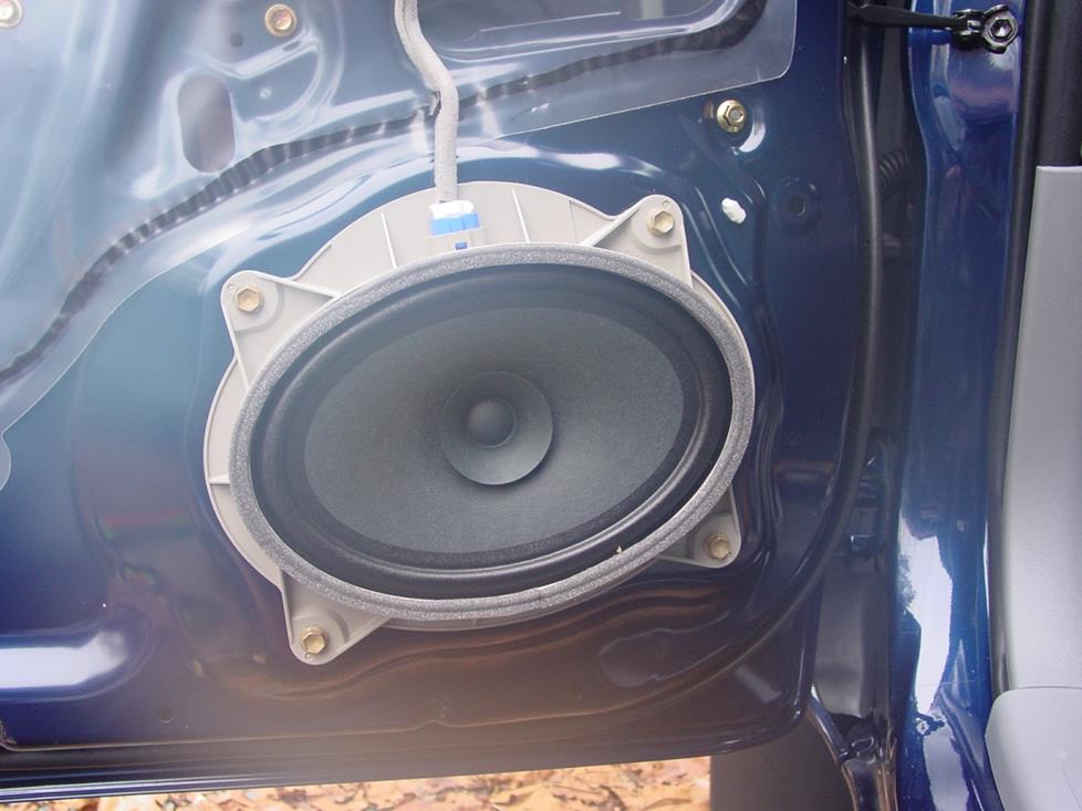The factory 6"x9" speaker in its molded bracket (Crutchfield Research Photo)