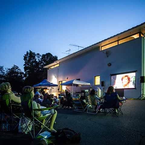 Our employees and their families kick back during outdoor movie night at our headquarters.