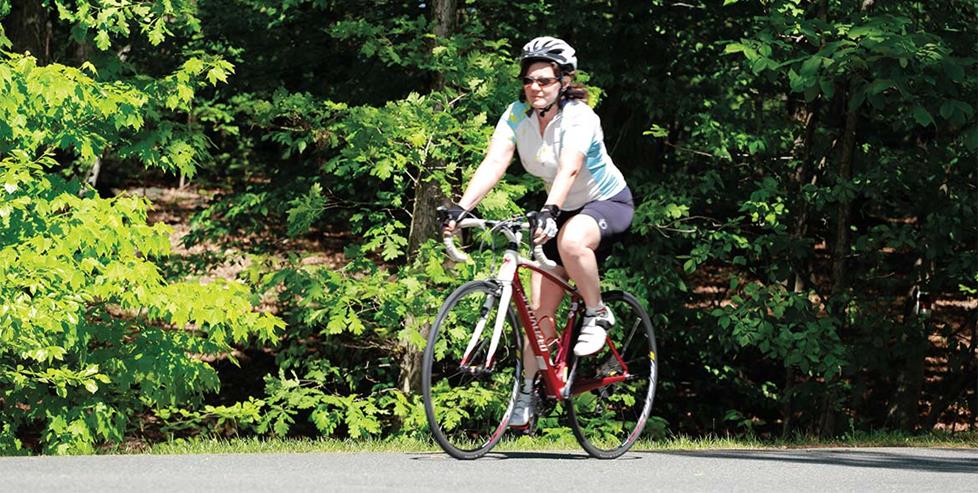 Deb riding her bike with the Garmin Forerunner 235