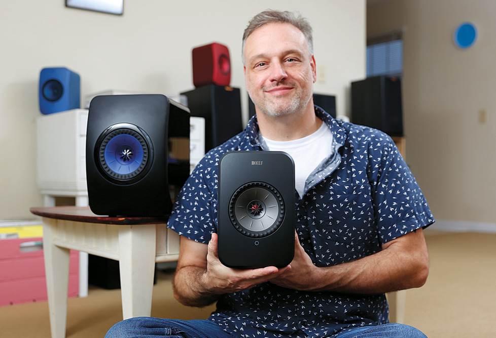 Eric showing the relative sizes of the speakers.