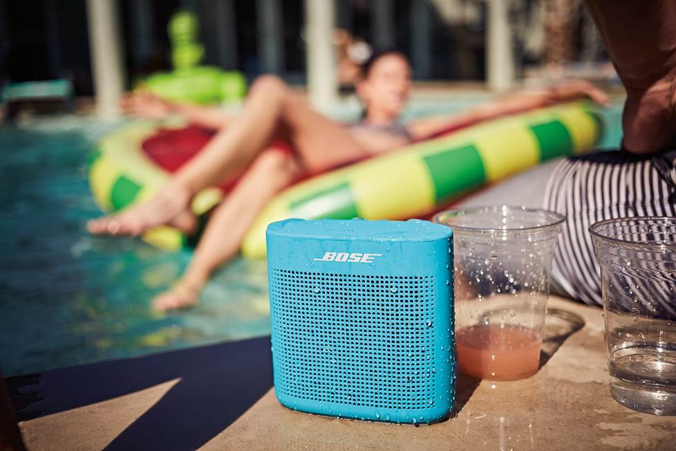 Bose soundlink 2 portable bluetooth speaker sitting by the pool.