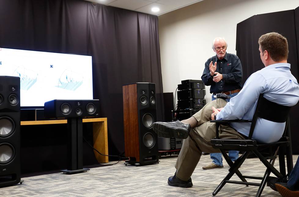 Kramer listening to the L800s in Polk's demo room.