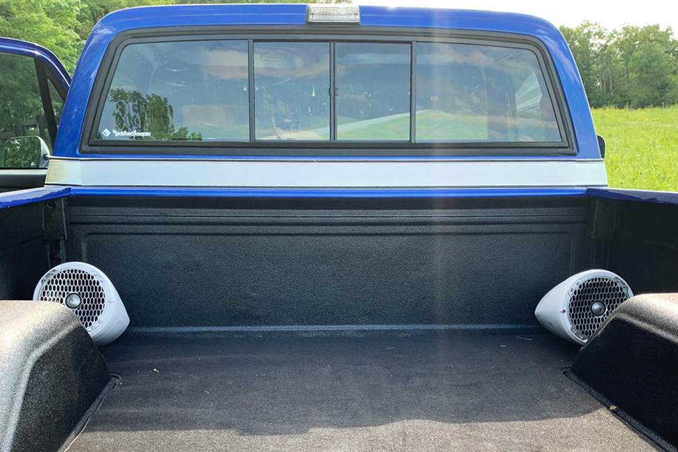 Marine speakers in the bed of the Chevy