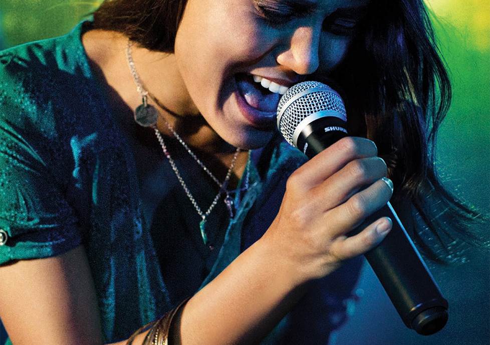 Singer using a wireless microphone