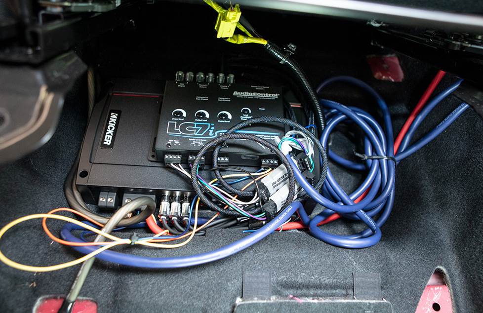 Car amp and line output converter being installed