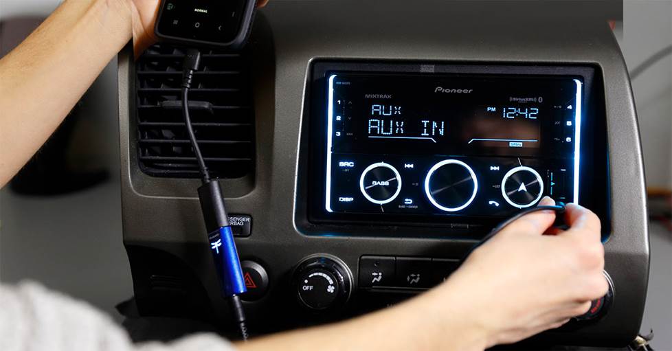 Person using stereo in car