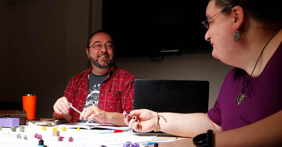 Two game players at a table