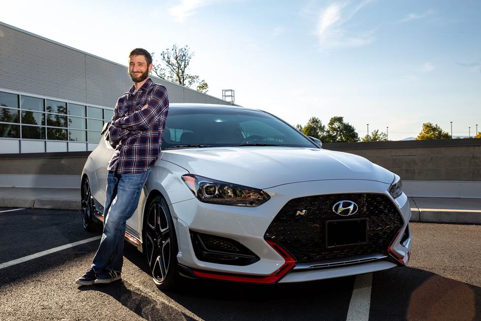 Buddy standing with his 2020 Hyundai Veloster