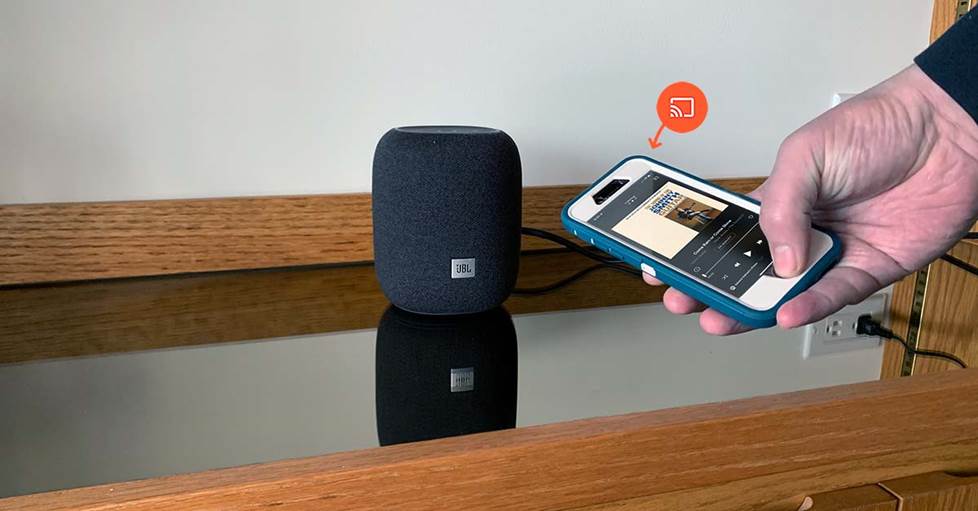 Holding phone with powered speaker