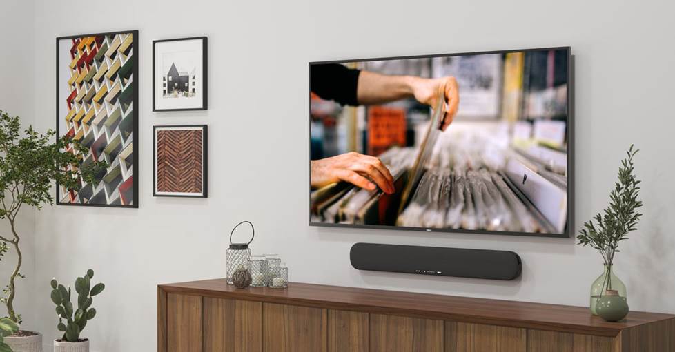 Yamaha SR-B20A Powered sound bar with built-in subwoofers mounted on a wall under a tv