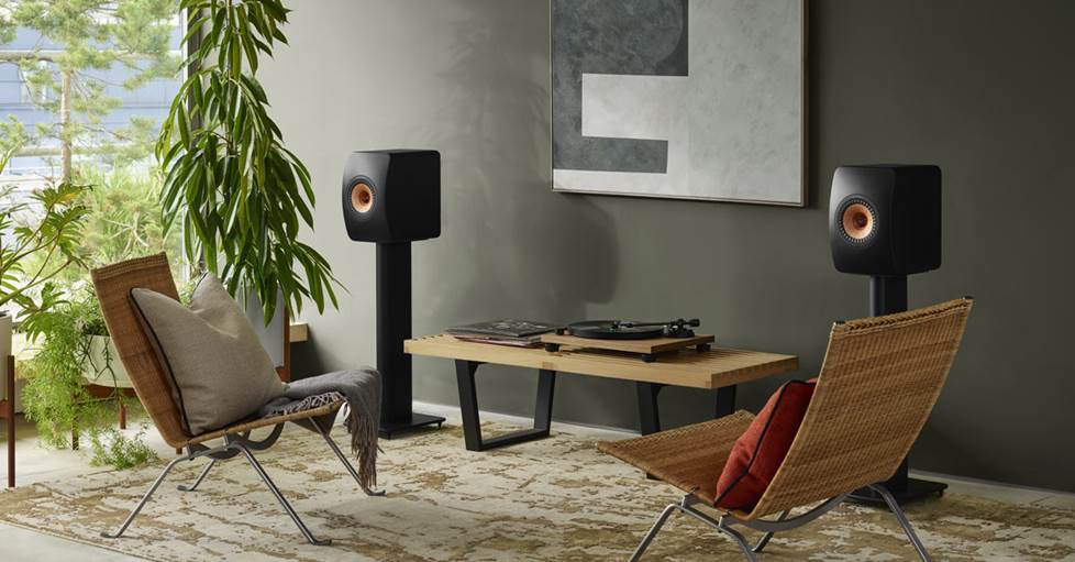 KEF LS50 Wireless II Powered stereo speakers on stands in a room
