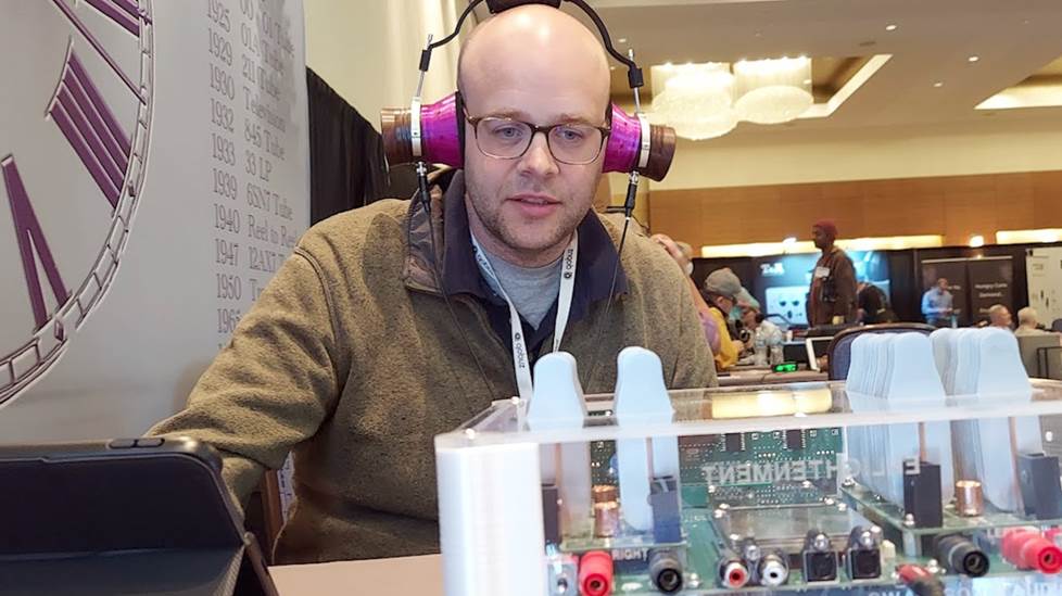 The author wearing quirky purple headphones