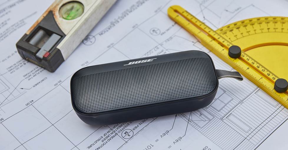 Bose SoundLink Flex lying on top of architectural drawings