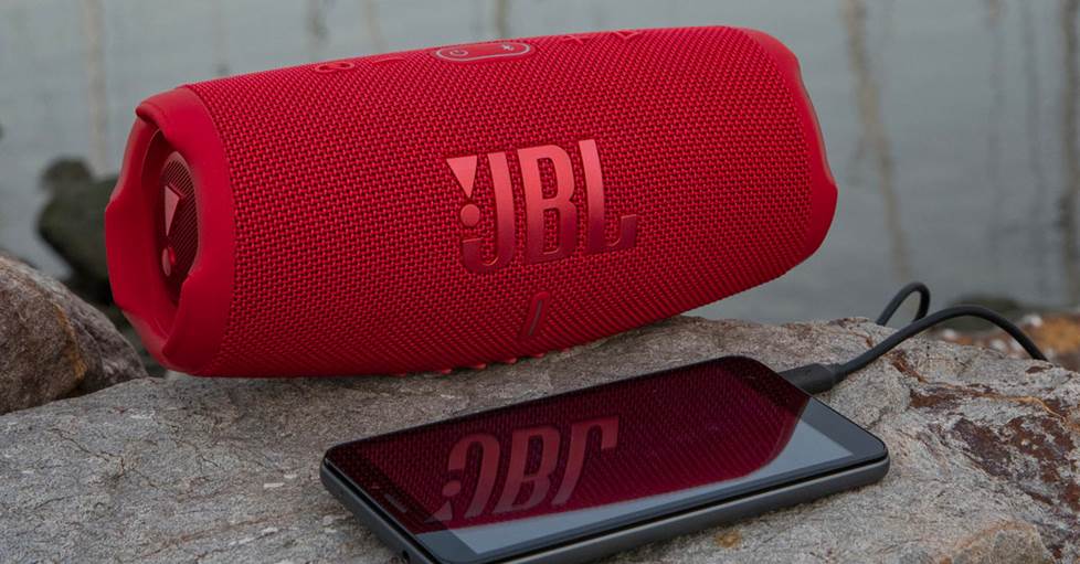 JBL Charge 5 with built in power bank charging a phone.