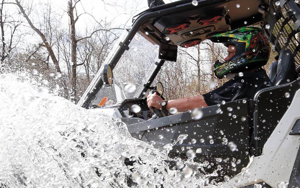 Polaris RZR fording the river.