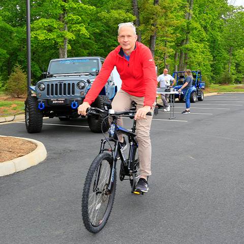 Tim uses pedal power to get around our leafy Charlottesville headquarters.