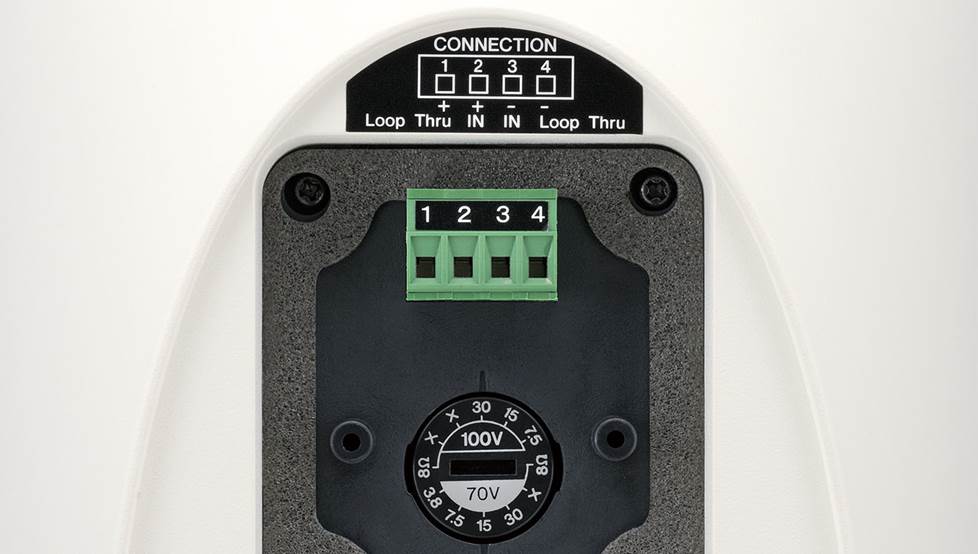 Close-up on back of speaker showing transformer switch options