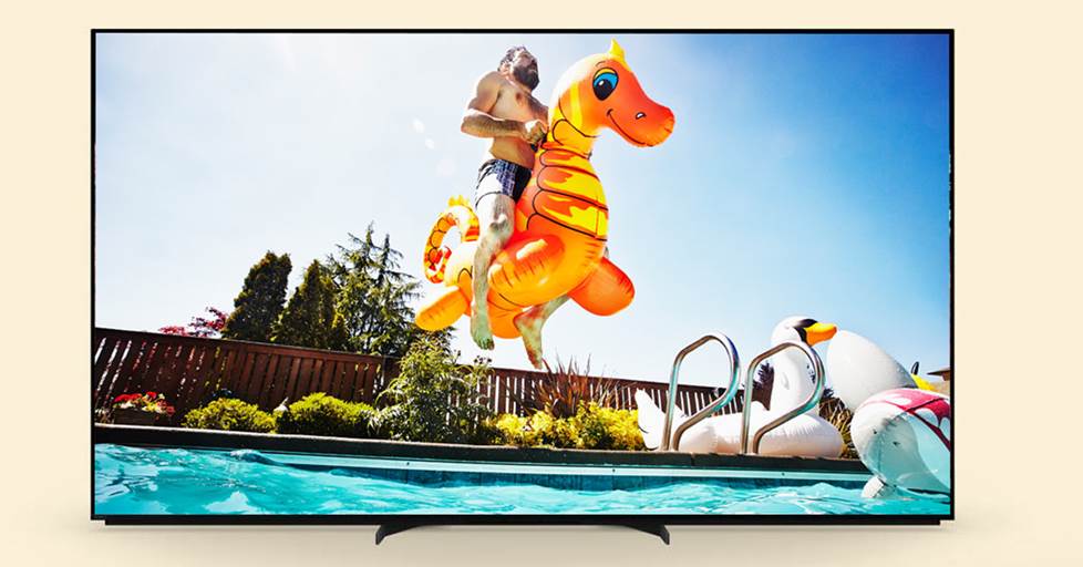 Sony X95L TV with an image of a man jumping in a pool with colorful pool toys