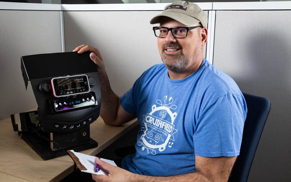 Dominic with Pioneer SPH-10BT receiver at his desk