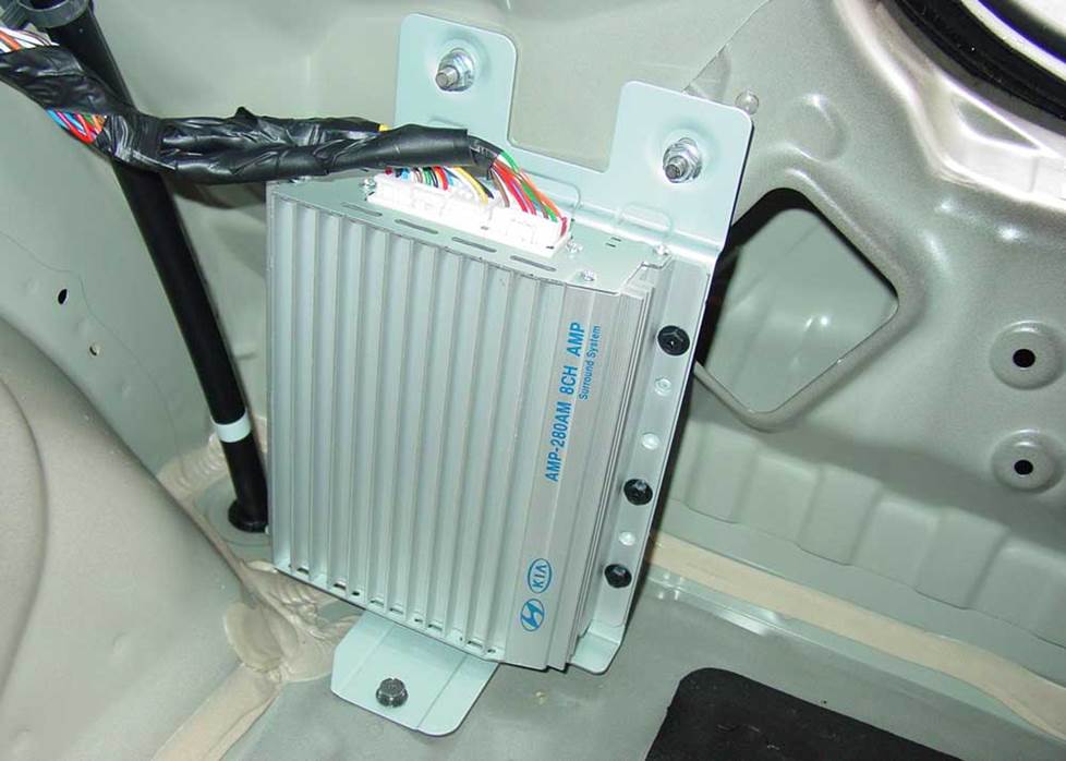 The factory amp is located in the right rear side panel (Crutchfield Research Photo)