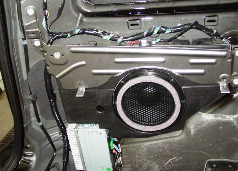 The factory subwoofer and amp (Crutchfield Research Photo)