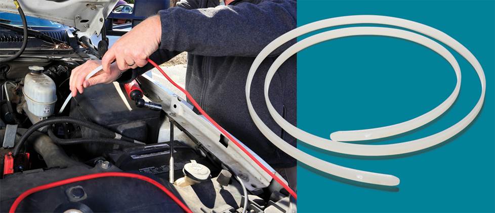 Split screen of "wire worm" tool on a blue background and in use inside a car engine bay