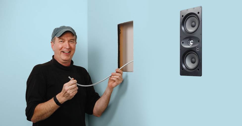 in wall speakers being installed