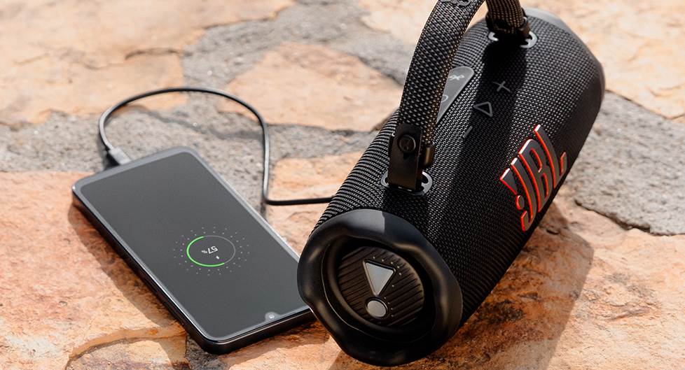 the JBL charge 6 bluetooth speaker charging a phone