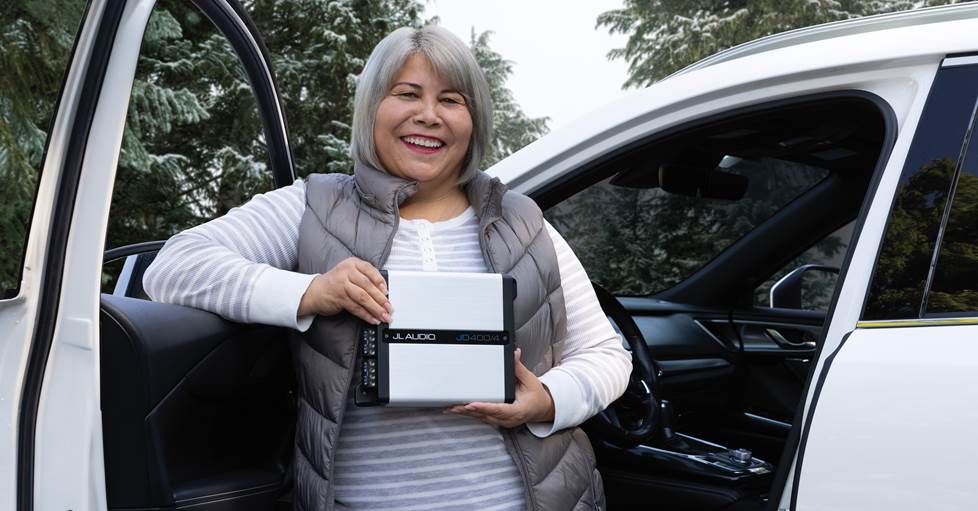 helpful advisor photographed by car with amplifier