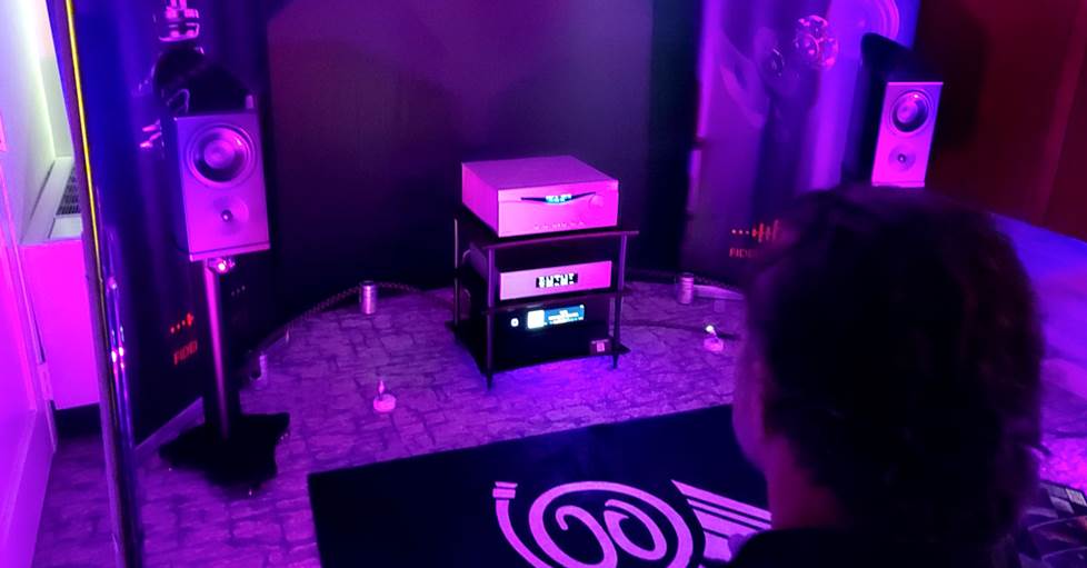 A listening room lit with purple light.