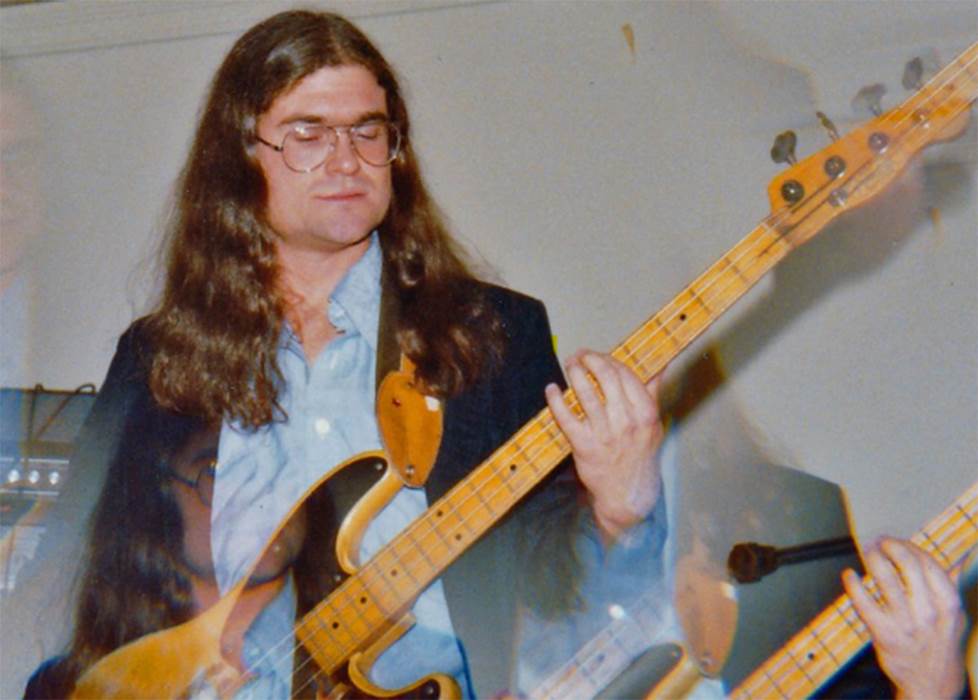 double exposure vintage photo of man playing bass