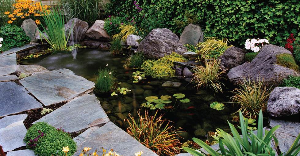 Rock speakers in landscaping
