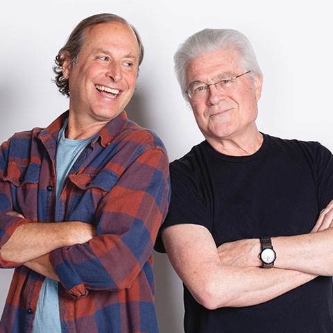 Resident guitar enthusiasts Ned and Charlie love to talk strings and things at the office.