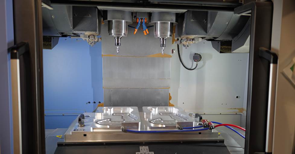A computer numerical control (CNC) device for preliminary shaping of PRS guitar bodies.